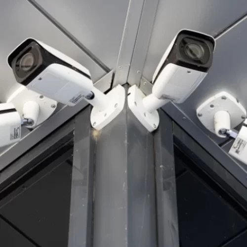 bottom-view-close-up-four-white-surveillance-cameras